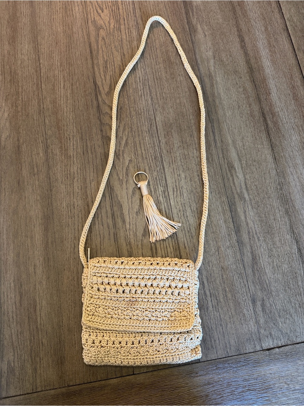 The Sak Crochet Crossbody Bag in Tan and Gold with Tassel